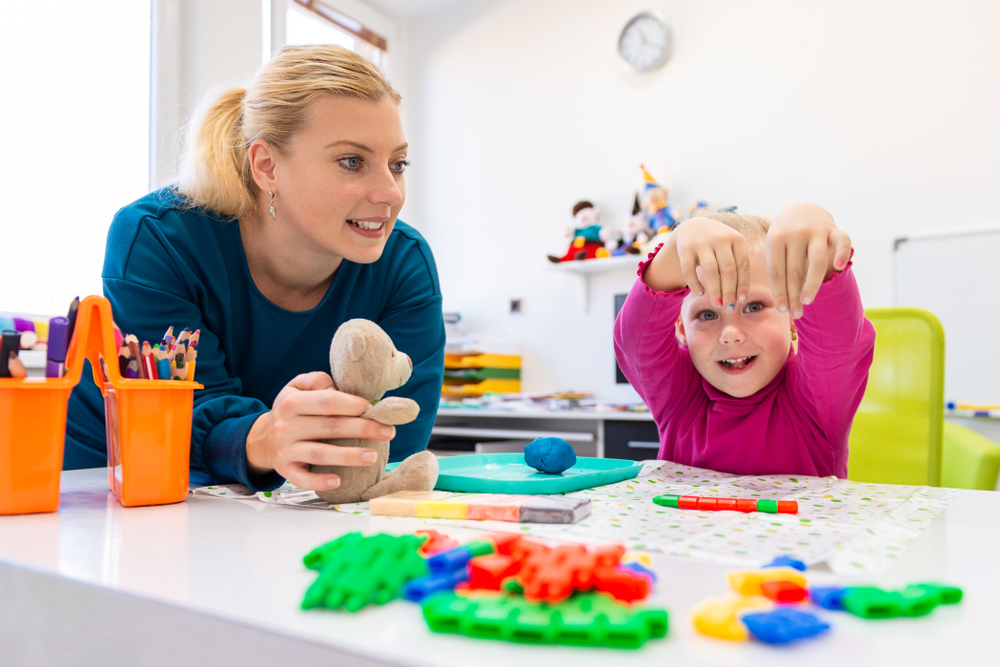 Toddler,Girl,In,Child,Occupational,Therapy,Session,Doing,Sensory,Playful